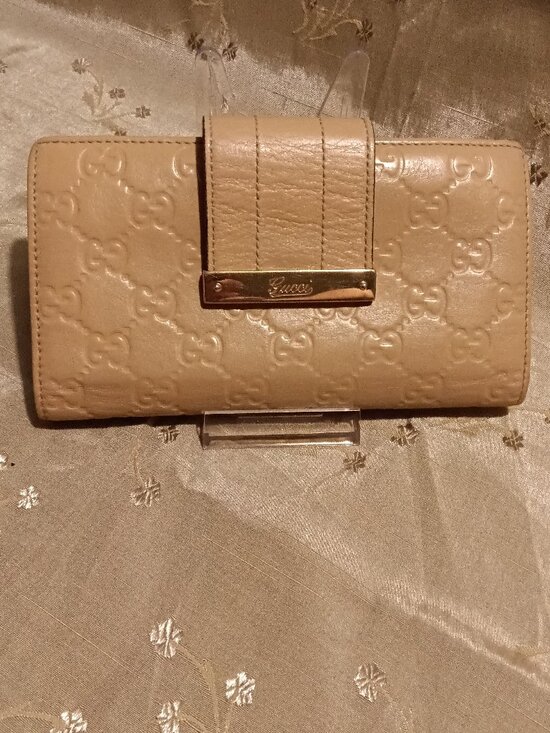 Gucci Handbags - Gucci Beige GG Embossed Guccissima Long Wallet with Metal Logo Bar